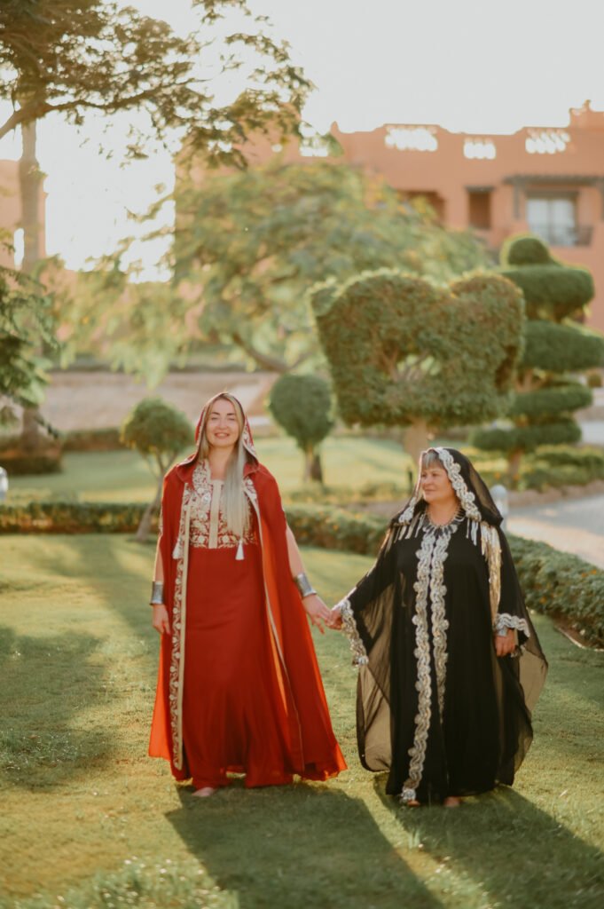 Couple in Bedouin outfits during an Arabian style photoshoot in Sharm El Sheikh’s desert at sunset.
