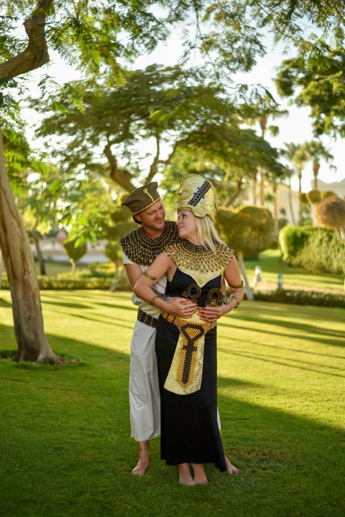 Person in Pharaonic costume posing in Sharm El Sheikh desert during photoshoot