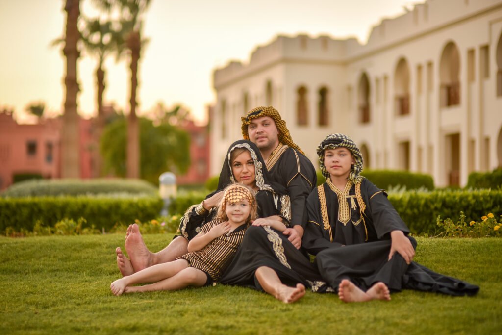 Family posing together on Sharm El Sheikh beach during photoshoot