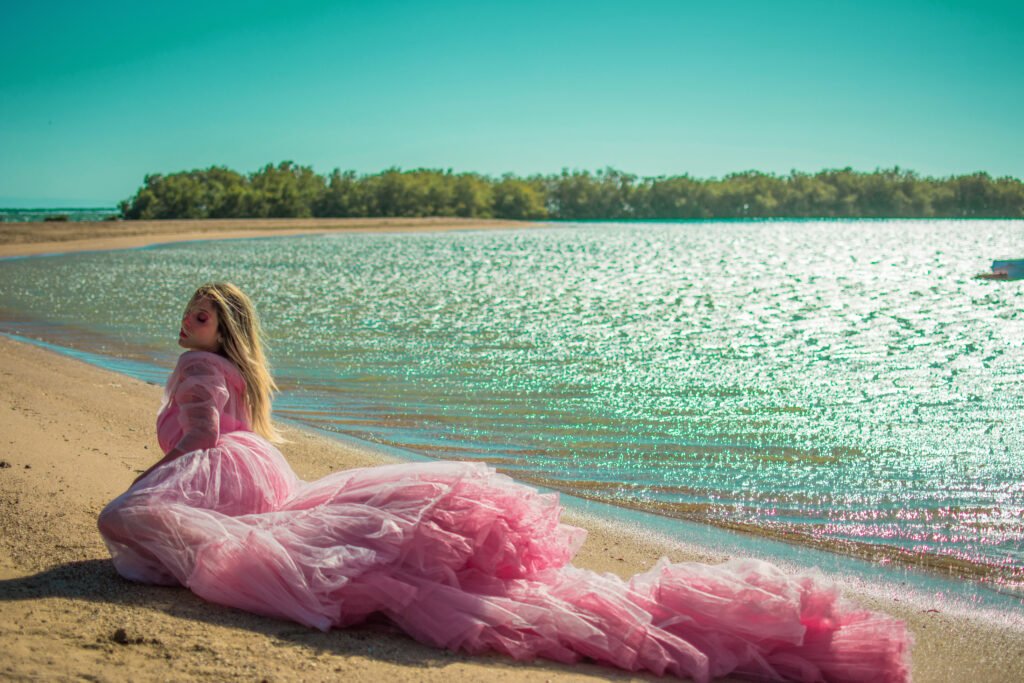 girl posing during a Nabq Bay photoshoot in Sharm El Sheikh by mangroves at sunset.