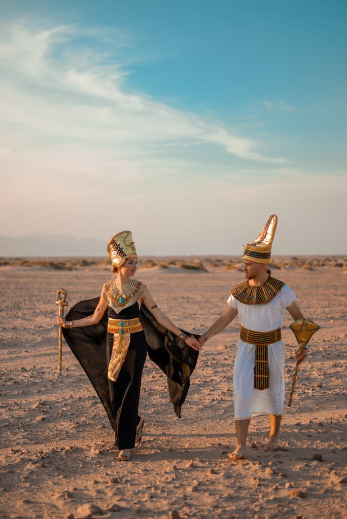 couple in a Pharaonic costume during a Pharaonic attire photoshoot in Sharm El Sheikh’s desert.
