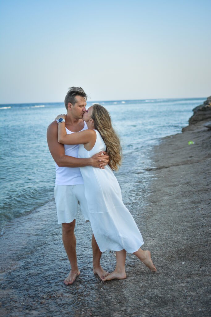 Photographers in Sharm capturing a couple in flying dresses on the beach