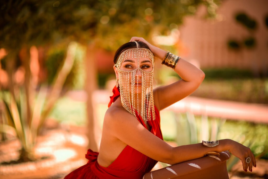 Woman in a flying dress during a solo photoshoot in Sharm El Sheikh by the Red Sea at sunset.